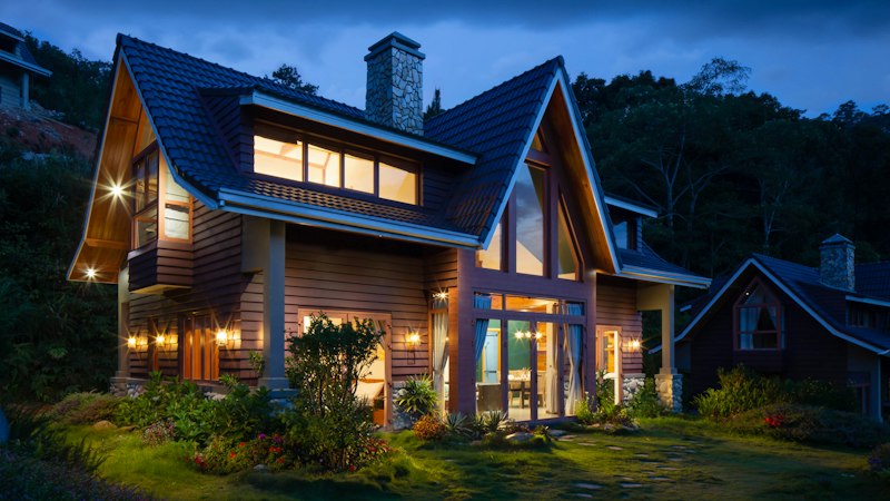 Two-story home with a front porch and green lawn